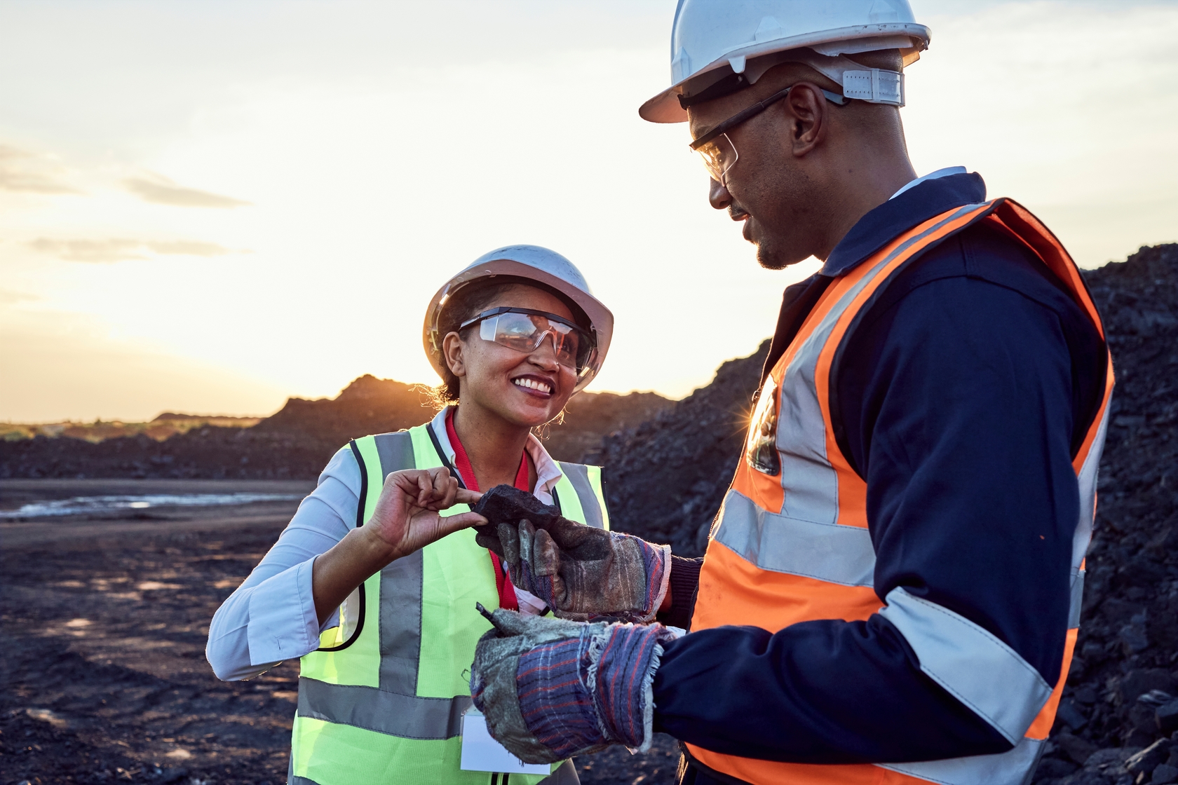 Two,Young,African,Mine,Workers,Wearing,Protective,Wear,Are,Discussing