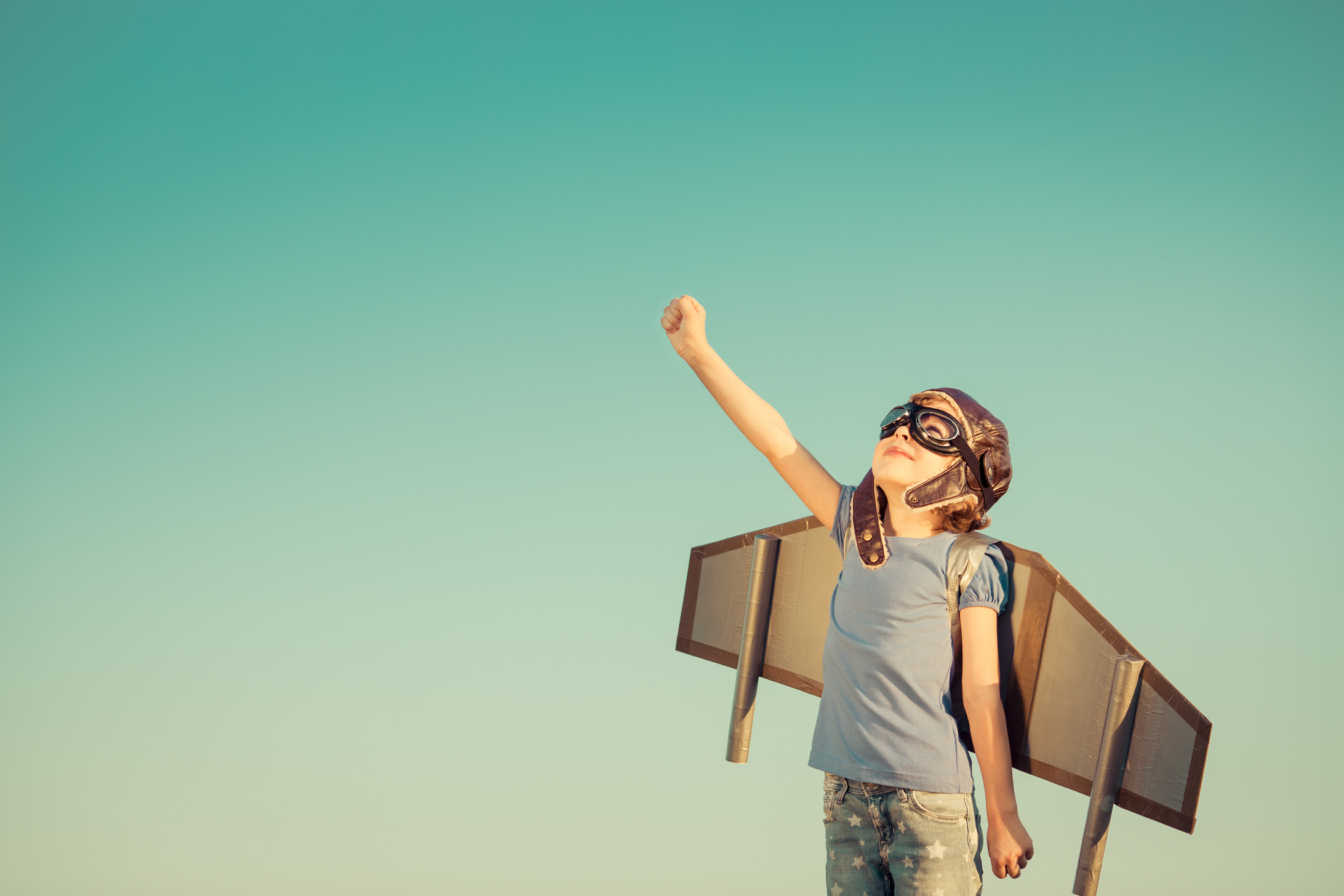 Happy,Child,Playing,With,Toy,Wings,Against,Summer,Sky,Background.